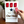 Countdown sign with red number tiles and a hand adjusting one, against a white background.