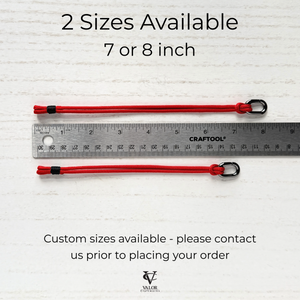 Two red bracelets on a white background, next to ruler to show available in 7 and 8 inch lengths