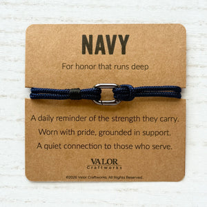 Navy bracelet on a brown card with text and Valor Craftworks branding.