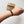 Navy blue bracelet on a wrist with a matching card labeled 'NAVY' on a light background