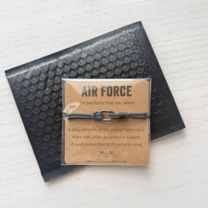 Air Force bracelet packaging with card on a white background