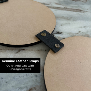 Genuine leather strap with Chicago screws on a marble surface