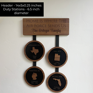 Wooden wall hanging with engraved locations and text on a white background