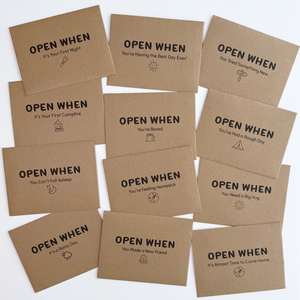 Set of 'Open When' cards on a white background