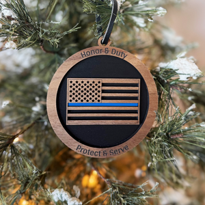Decorative ornament with American flag design on a Christmas tree