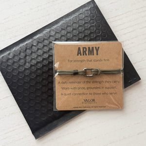 Army-themed bracelet packaging with text on a textured surface