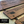 Close-up of engraved walnut duty station boards with custom Air Force locations and years