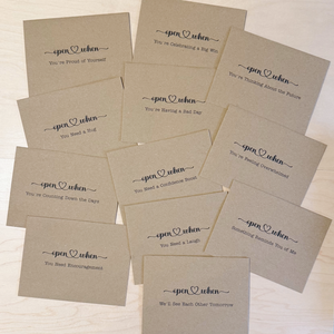 Full set of kraft Open When envelopes with pre-labeled encouragement prompts