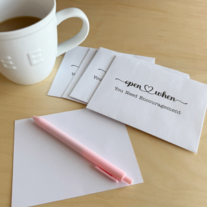 Open When envelopes and blank postcards for personalized messages